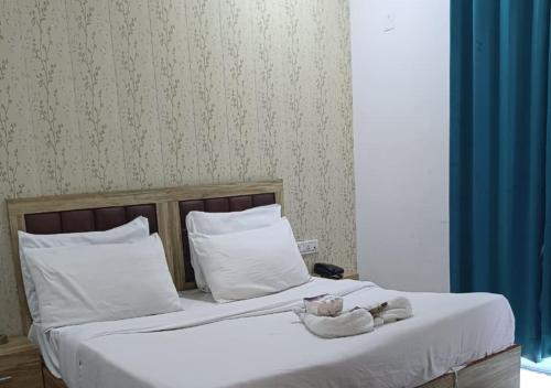 Кровать или кровати в номере Akshay dream stay