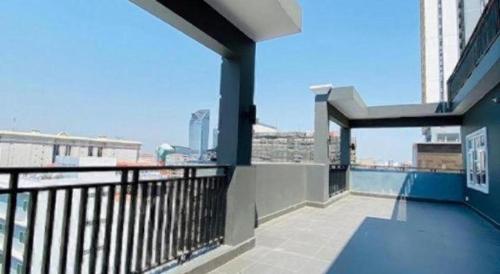 a balcony of a building with a view of the water at ICON Hotel in Phnom Penh