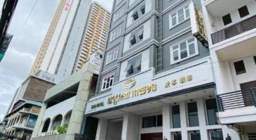 a building in a city with tall buildings at ICON Hotel in Phnom Penh