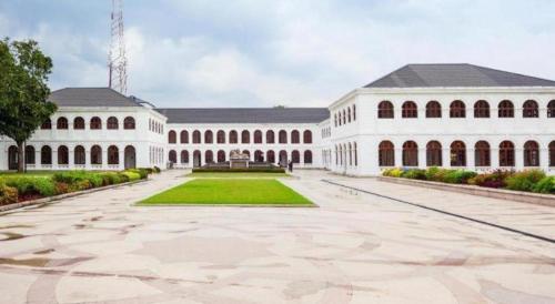 a large white building with a large courtyard at D Villas in Colombo
