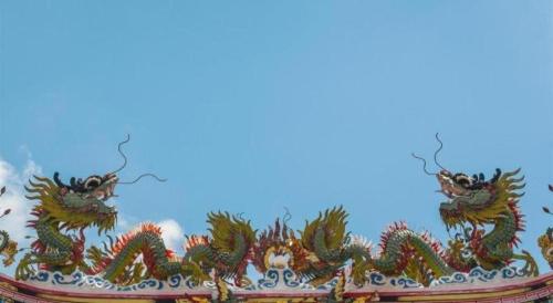 a chinese dragon decoration on the roof of a building at At Home at Udon in Udon Thani