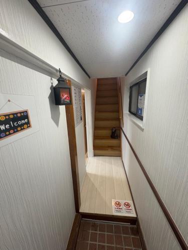 a staircase in a building with a stair case at 东京瑞江独栋直达新宿秋叶原 in Tokyo