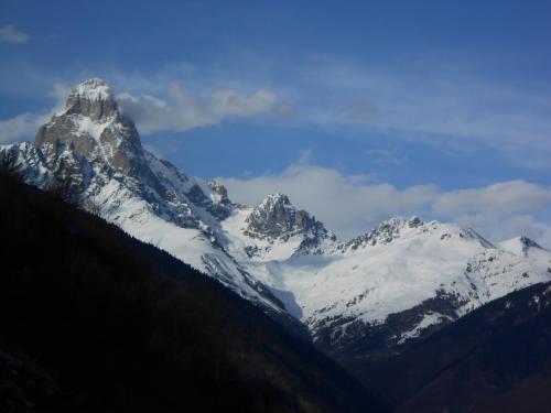a mountain with snow on top of it at Mziuri Guest House in Mestia