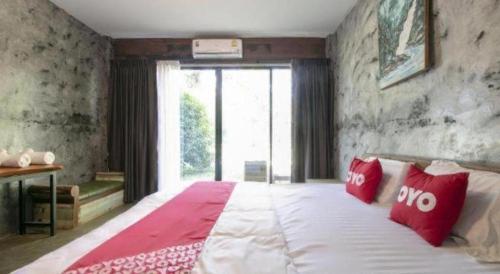 Cama o camas de una habitación en OYO 75374 Baan Rak Mai