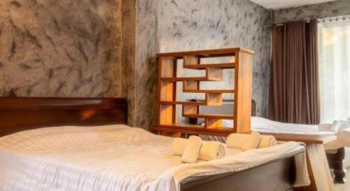 Cama o camas de una habitación en OYO 75374 Baan Rak Mai