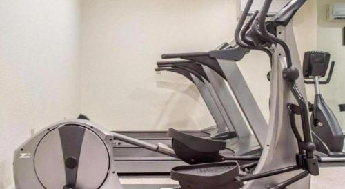 a gym with a treadmill in a room at Econo Lodge Ithaca Airport in Ithaca