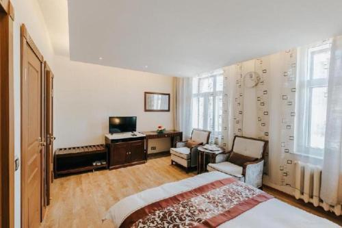 Postel nebo postele na pokoji v ubytování Mika Hotel