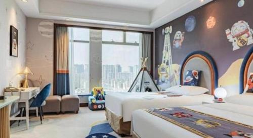 a hotel room with two beds and a desk and a bedroom at New Century Grand Hotel Zhuji Yaojiang in Shaoxing