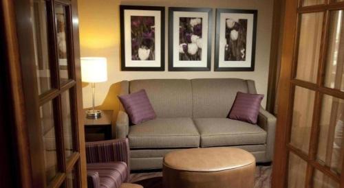a living room with a couch and purple pillows at Quality Inn & Suites Detroit Lakes in Detroit Lakes