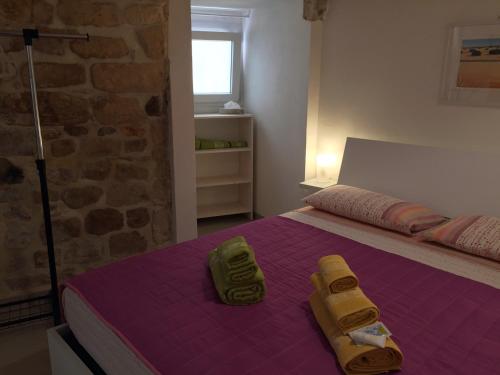 A bed or beds in a room at Dammuso Siciliano