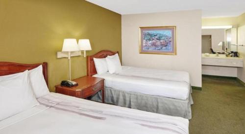 a hotel room with two beds and a table with a telephone at Chicago Lake Shore Hotel in Chicago