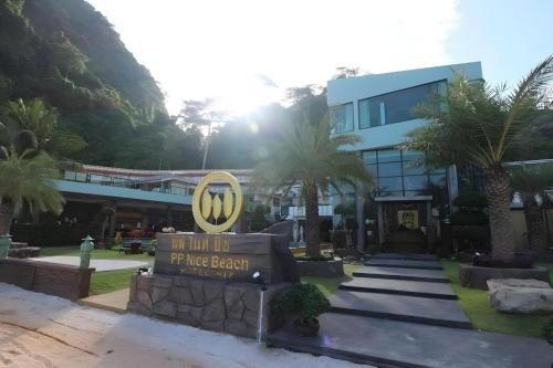 a sign in front of a building with a wii sign at Phi Phi Nice Beach Hotel Hip in Phi Phi Don