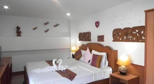 Postel nebo postele na pokoji v ubytování Ngamta Hotel