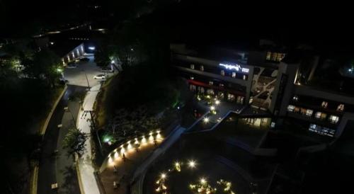 an overhead view of a street at night with lights at KT&G Sangsangmadang Chuncheon Stay (Korea Quality) in Chuncheon