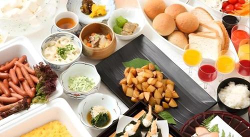 a table with many different types of food on it at Daini Fuji Hotel in Nagoya