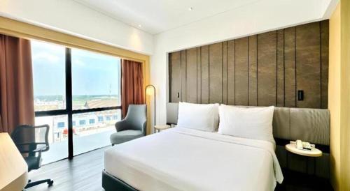 Katil atau katil-katil dalam bilik di Brits Hotel Karawang