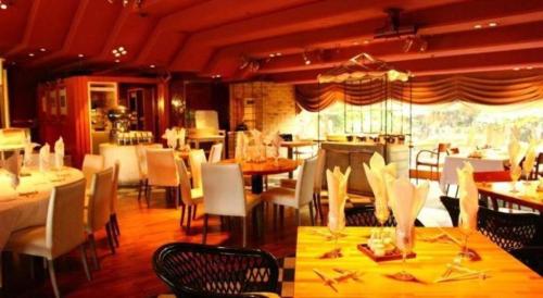 a dining room with tables and chairs at Gunma Royal Hotel in Maebashi