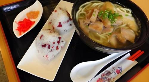 a tray of food with a bowl of soup and chopsticks at Hotel Thida No Sato in Miyako Island