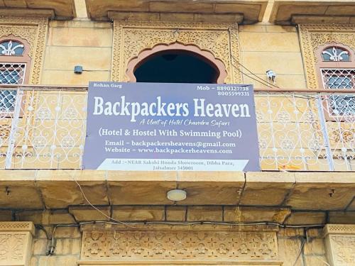 a sign on the side of a building at Backpackers Heaven Jaisalmer in Jaisalmer