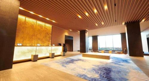 a large room with a large pool in the middle of it at HOTEL CLAD in Fuji