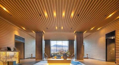 a large lobby with a view of a mountain at HOTEL CLAD in Fuji