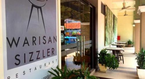 a sign that reads warkin st kitchen in a building at The Regency Hotel Seri Warisan in Taiping
