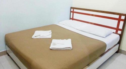 Una cama o camas en una habitación de Sakiza View Mersing