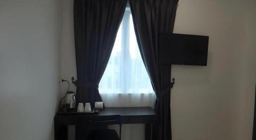 Televisyen dan/atau pusat hiburan di Hotel Seri Geliga