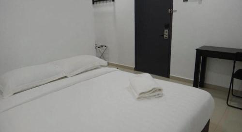 Katil atau katil-katil dalam bilik di Hotel Seri Geliga