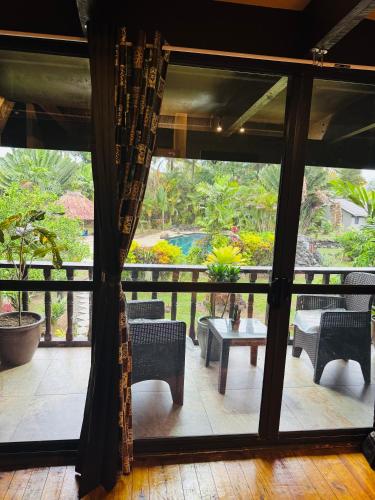 a view of a patio with chairs and a table at MIRZ Accomodation in Pacific Harbour