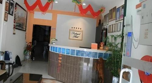 a room with a bar in the middle of a room at Rafayeh Hotel in Seremban
