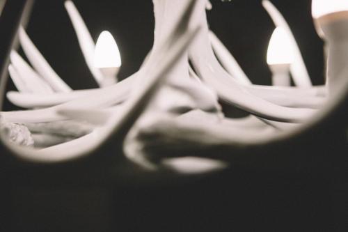 a close up of a light fixture with a candle at The Stag at Stow in Stow on the Wold