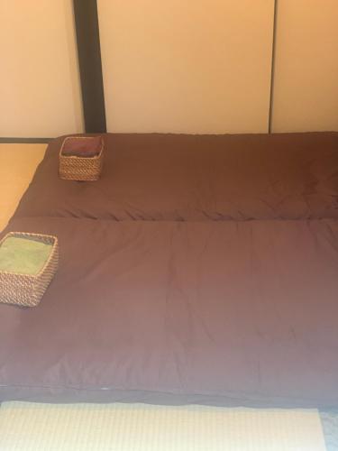 Postel nebo postele na pokoji v ubytování 仁信小屋