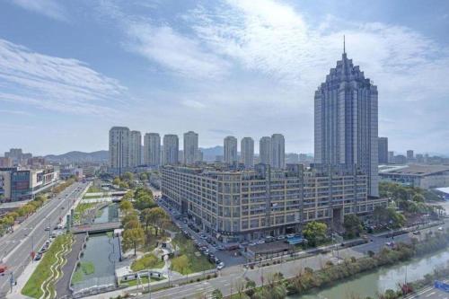 an aerial view of a city with tall buildings at Echarm Hotel Taizhou International Convention and Exhibition Center 