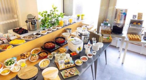 a buffet line with many different types of food at Hotel Areaone Miyazaki in Miyazaki