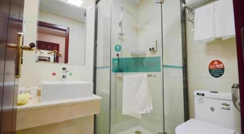 a bathroom with a toilet and a sink and a shower at GreenTree Alliance Anhui Hefei South Passenger Station South High Speed Railway Station Hotel in Hefei