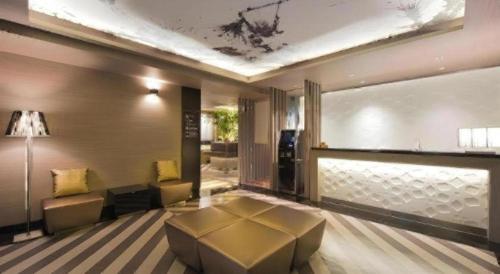 a living room with a couch and a table at Hotel Ann Tsukiji in Tokyo
