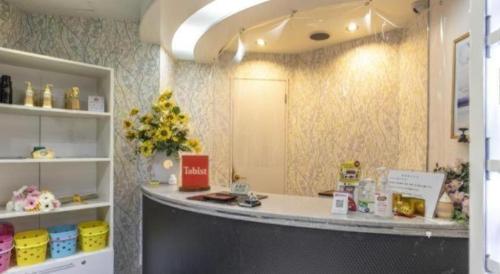 a hair salon with a counter in a room at Tabist Hotel Please Kobe in Kobe