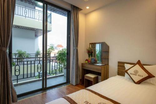 Postel nebo postele na pokoji v ubytování Hoi An Paradise Villa