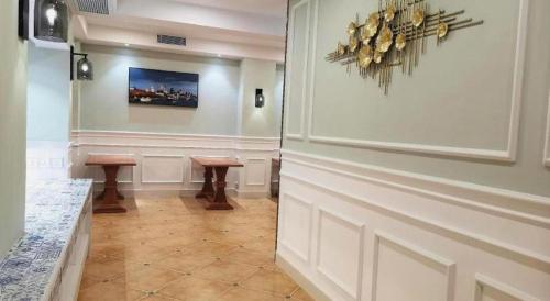 a hallway with two stools in a room at London Hotel in Macau