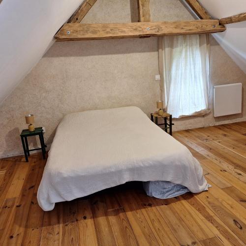 Ένα ή περισσότερα κρεβάτια σε δωμάτιο στο Gîte de la douce évasion