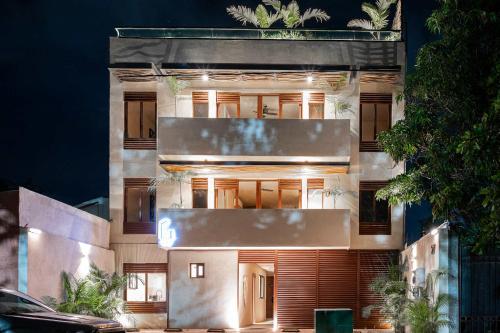 a building with a lit up facade at night at Romantic Getaway Suite w-Private Terrace in Bucerías
