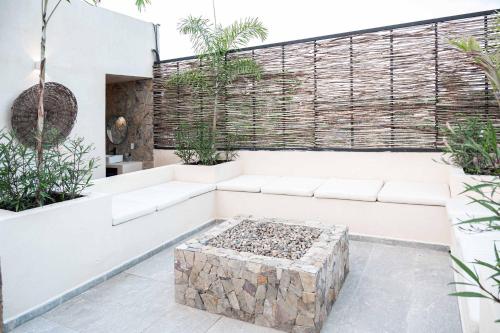 a living room with a white couch and a table at Romantic Getaway Suite w-Private Terrace in Bucerías