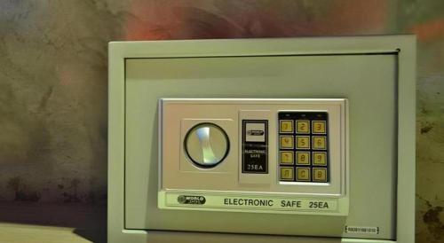 a picture of an electronic device in front of a painting at The B Ranong Trend Hotel in Ranong