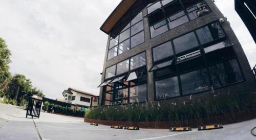 a large building with many windows on a street at Triple B sleep and relax in Nakhon Ratchasima