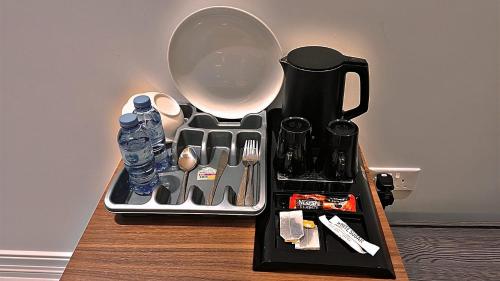 a black tray with utensils on a table at Al Safwa One in Al Ḩadd