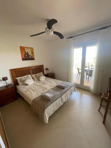 a bedroom with a bed and a ceiling fan at Casa Serena - Sucina in Sucina