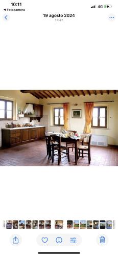 a kitchen and dining room with a table and chairs at Podere La Ceppa1 in Sinalunga