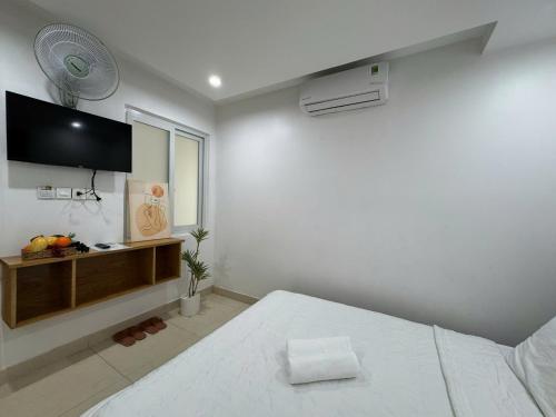Ένα ή περισσότερα κρεβάτια σε δωμάτιο στο Ruby Star Hotel - Apartment Biển Vũng Tàu
