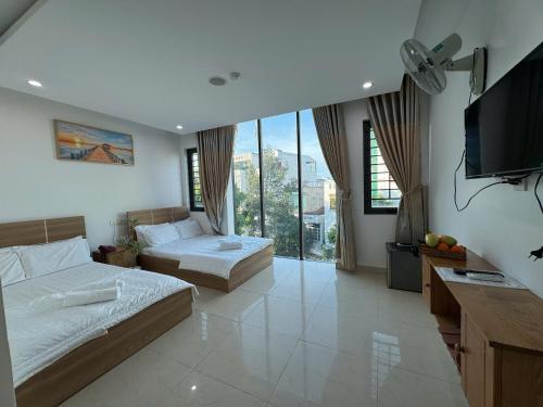 Ένα ή περισσότερα κρεβάτια σε δωμάτιο στο Ruby Star Hotel - Apartment Biển Vũng Tàu